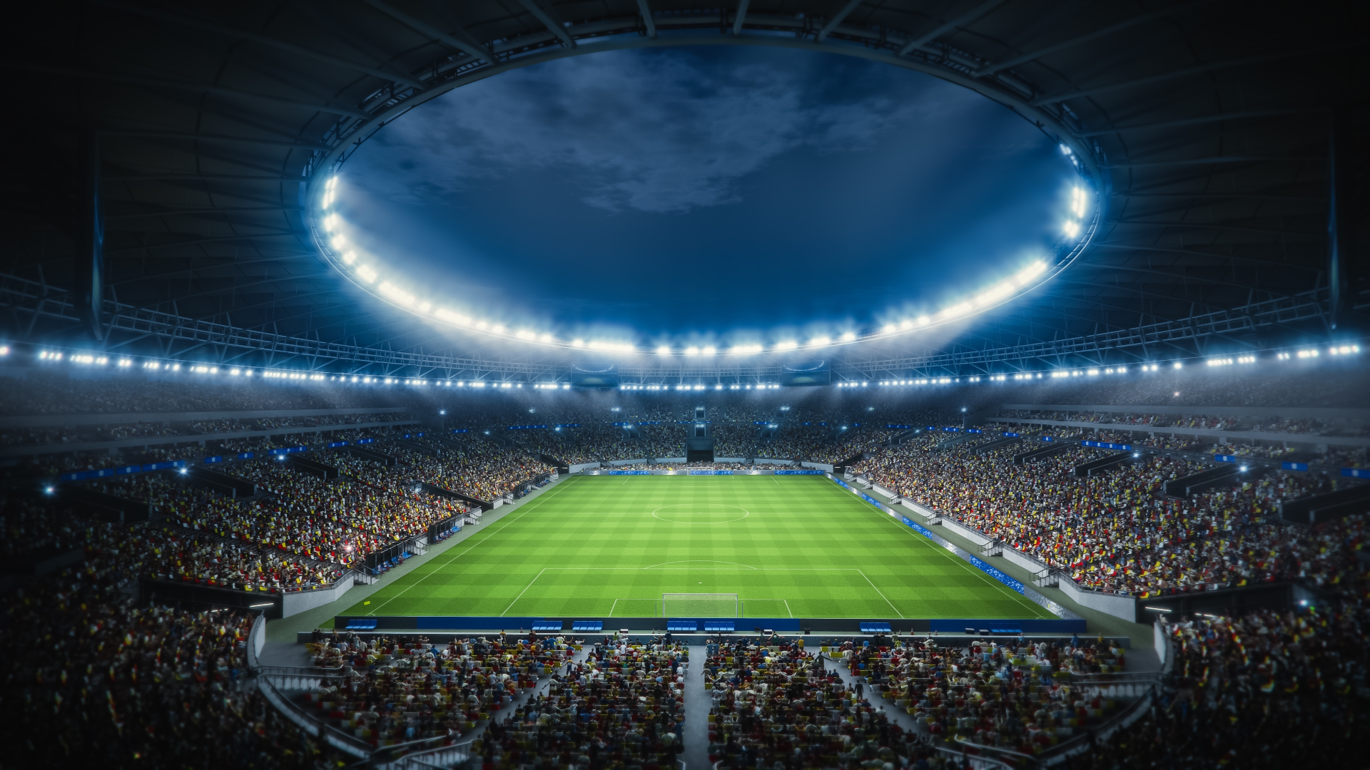 Estadio de futebol lotado iluminado durante a noite